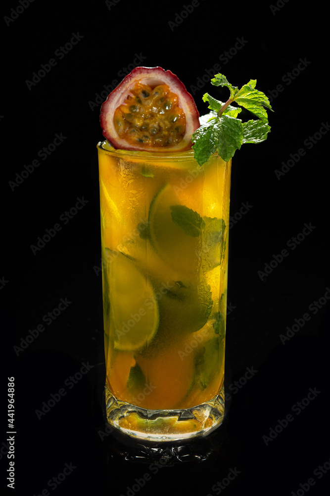 Closeup glass of Mojito with passion fruit ( maracuya ) lime and green leaf mint isolated Closeup glass of Mojito with passion fruit ( maracuya ) lime and green leaf mint isolated