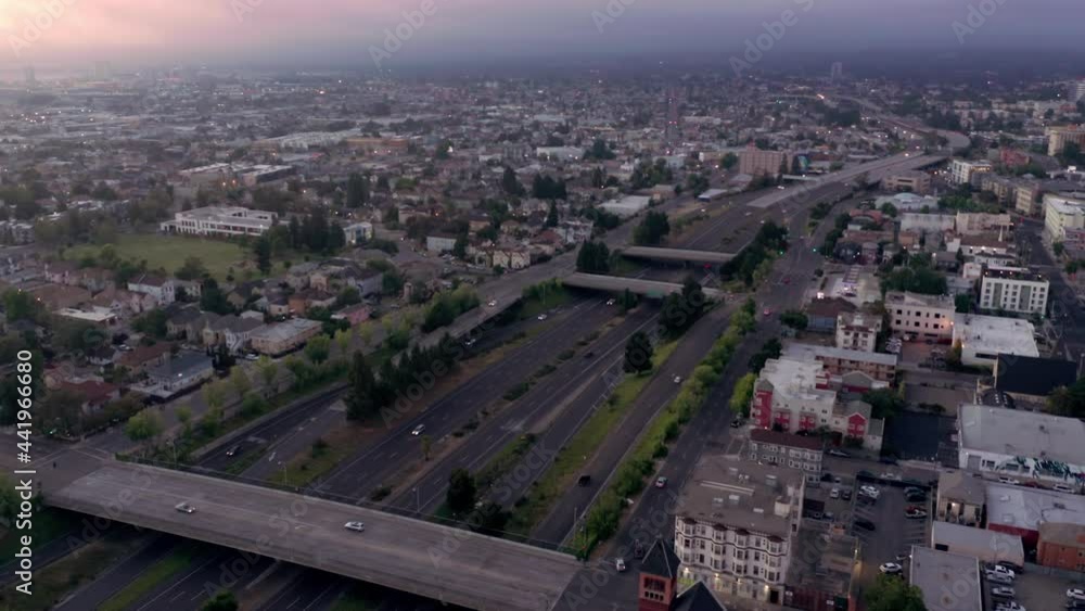Aerial: traffic on 990 freeway at sunset. Oakland, USA Aerial: traffic on 990 freeway at sunset. Oakland, USA