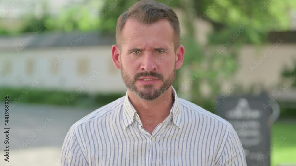 Outdoor Portrait of Angry Middle Aged Man Screaming, Shouting Outdoor Portrait of Angry Middle Aged Man Screaming, Shouting