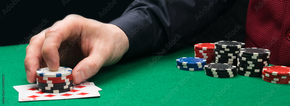 a game moment on the green table, increasing the bet with a winning combination of cards a game moment on the green table, increasing the bet with a winning combination of cards
