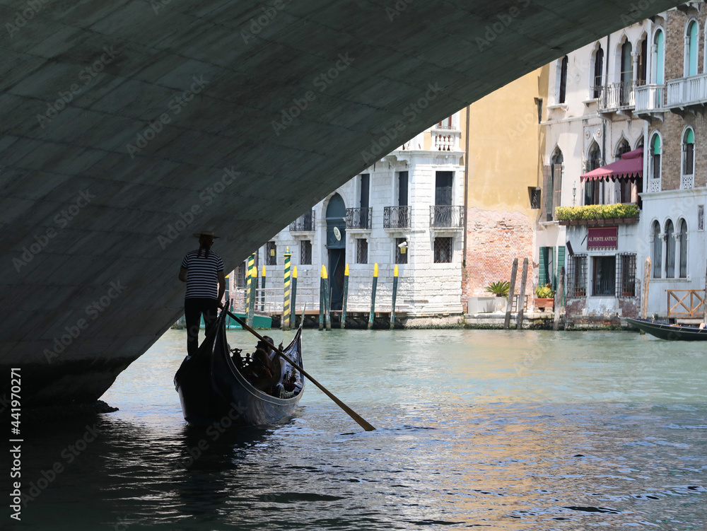 Gondola under Rialto bridge in Venice