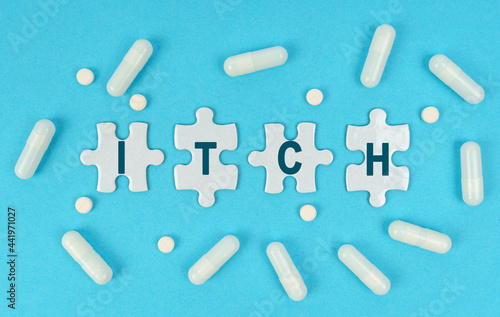 On a blue background, there are pills and puzzles with the inscription - ITCH