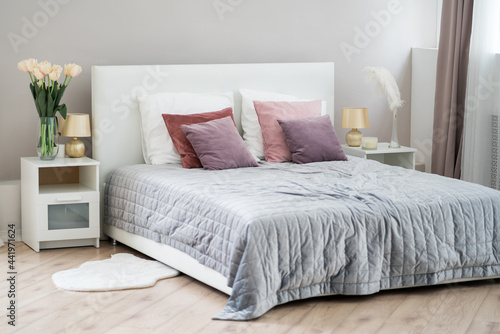Beautiful modern bedroom  interior concept with crumpled bed linen