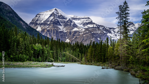 Fototapeta Naklejka Na Ścianę i Meble -  Long Exposure makes the Robson River look smooth with in the background the clear peak of Mount Robson, the highest peak in the Canadian Rockies, British Columbia, Canada