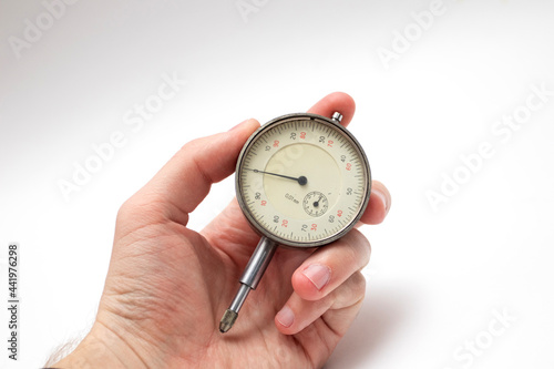 Engineer's hand with a micrometer photo