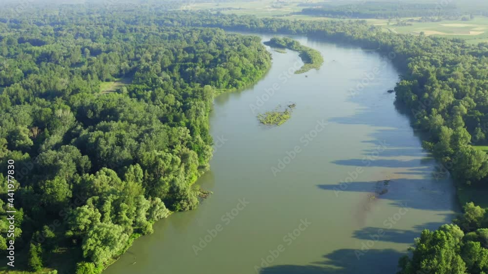 Aerial photo of the natural Drava River in Croatia, surrounded by the forest Aerial photo of the natural Drava River in Croatia, surrounded by the forest
