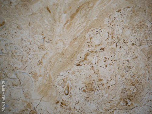 Beige marble background with light brown inclusions.