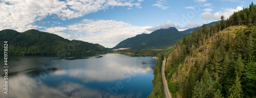 Aerial Panoramic View of a Highway in Canadian Mountain Landscape. Colorful Sunny Summer Morning. Located in Fraser Valley, East of Vancouver, British Columbia, Canada. photo
