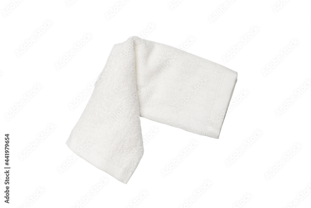 White fluffy cotton towel isolated on a white background. White fluffy cotton towel isolated on a white background.