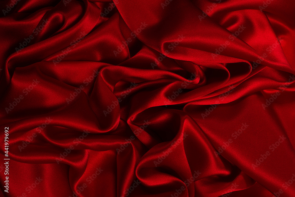 Fototapeta premium Rich and luxury red silk fabric texture background.