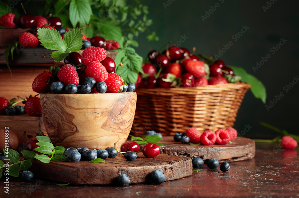 Assorted fresh berries with leaves. Assorted fresh berries with leaves.
