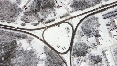 The transport ring in winter. A small traffic of cars driving on the road. Winter highways. Weather in Siberia