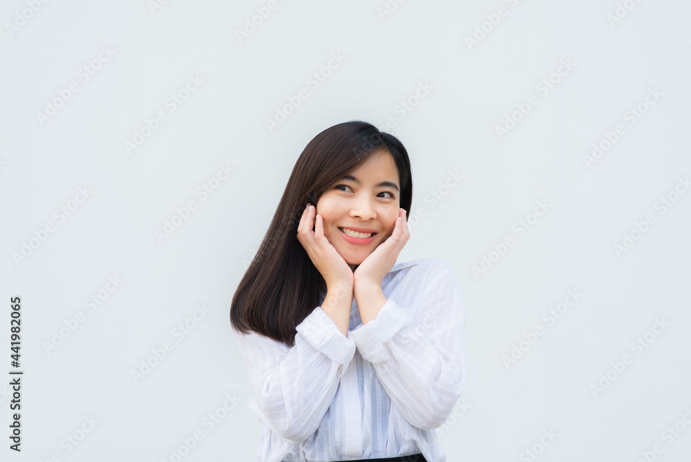 close up attractive adult business woman asian girl with happy and smile against white concrete wall office. close up attractive adult business woman asian girl with happy and smile against white concrete wall office.