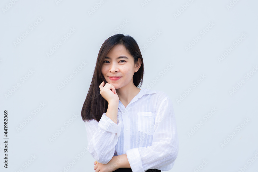 close up attractive adult business woman asian girl with happy and smile against white concrete wall office. close up attractive adult business woman asian girl with happy and smile against white concrete wall office.