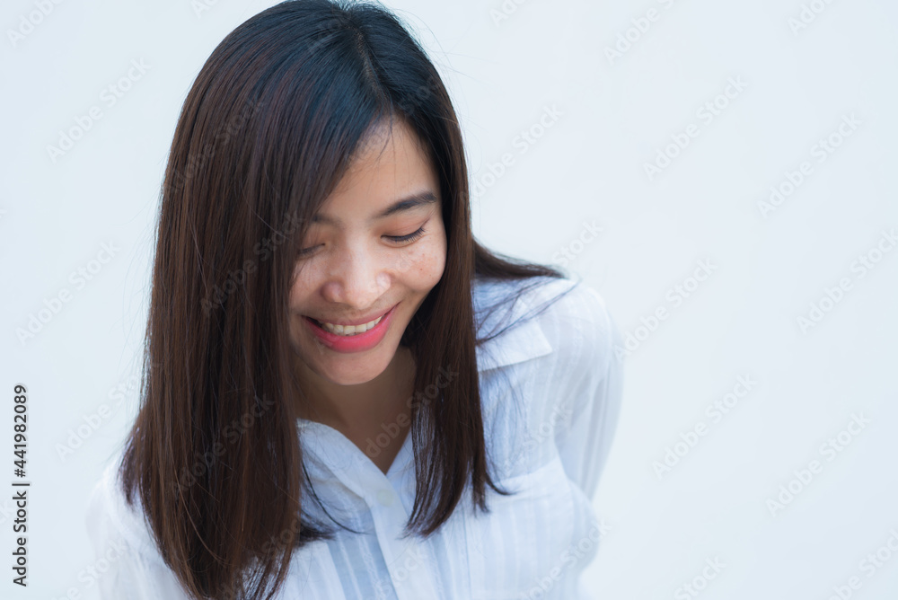 close up attractive adult business woman asian girl with happy and smile against white concrete wall office. close up attractive adult business woman asian girl with happy and smile against white concrete wall office.