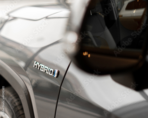 Papier peint hybrid car Logo on the back side of automobile