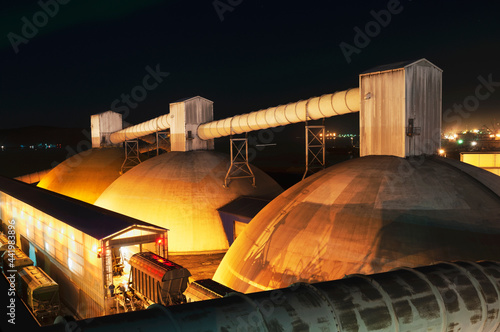 Warehouses on the shore for storage of bulk cargo have the form of a hemisphere