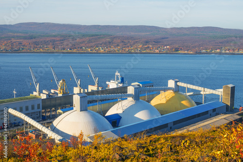 Warehouses on the shore for storage of bulk cargo have the form of a hemisphere
