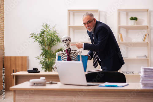 Dead employee working in the office