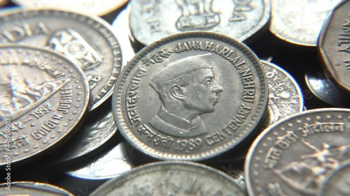 Stack of Indian vintage coins, Jawaharlal Nehru picture on a Indian vintage coin, selective focus, India photo