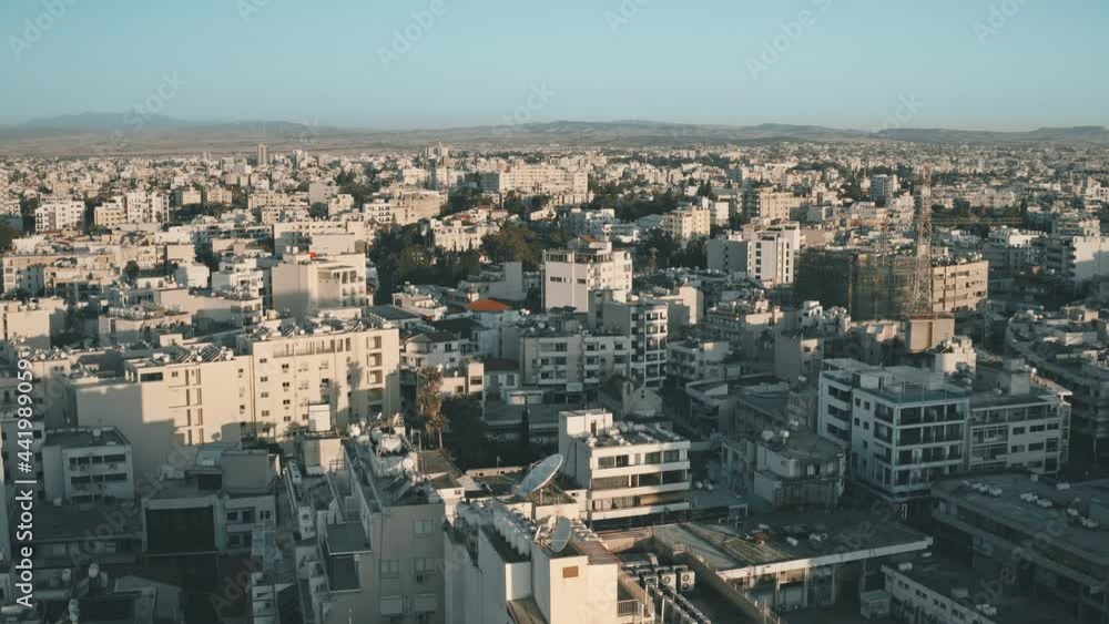 Aerial cityscape of Larnaca city, Cyprus. White buildings against blue sky. Real estate for business. Summer vacation destination. Travel, outdoor, vacation, holiday, journey. Cinematic drone flight Aerial cityscape of Larnaca city, Cyprus. White buildings against blue sky. Real estate for business. Summer vacation destination. Travel, outdoor, vacation, holiday, journey. Cinematic drone flight