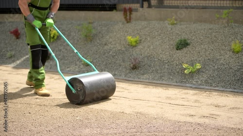 Wallpaper Mural Tow Lawn Roller Pushed by Gardener Torontodigital.ca
