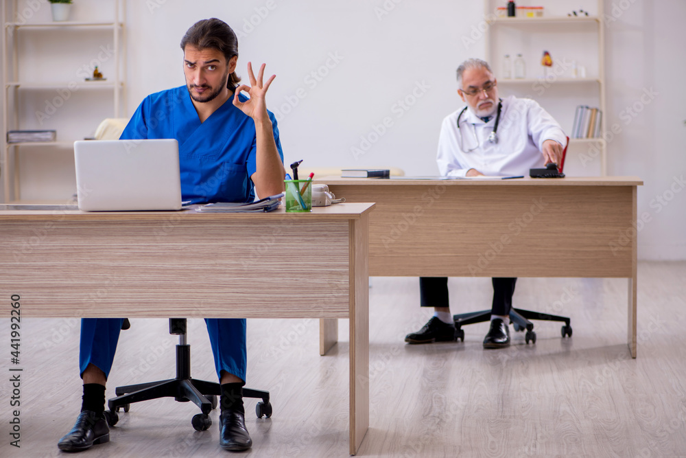 Two doctors working in the clinic Two doctors working in the clinic
