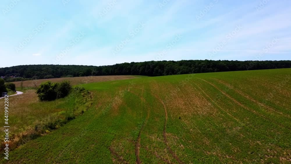 Aerial drone view of a flying over the rural agricultural landscape. Aerial drone view of a flying over the rural agricultural landscape.