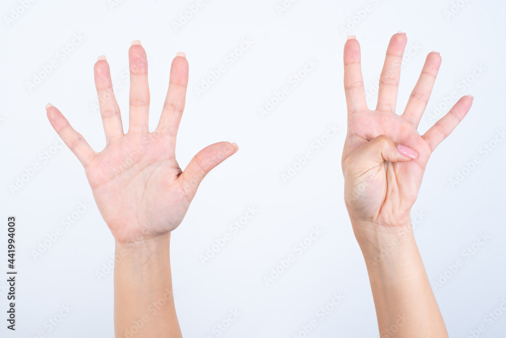 Woman's hands with pink manicure over isolated white background pointing with fingers number nine. Woman's hands with pink manicure over isolated white background pointing with fingers number nine.
