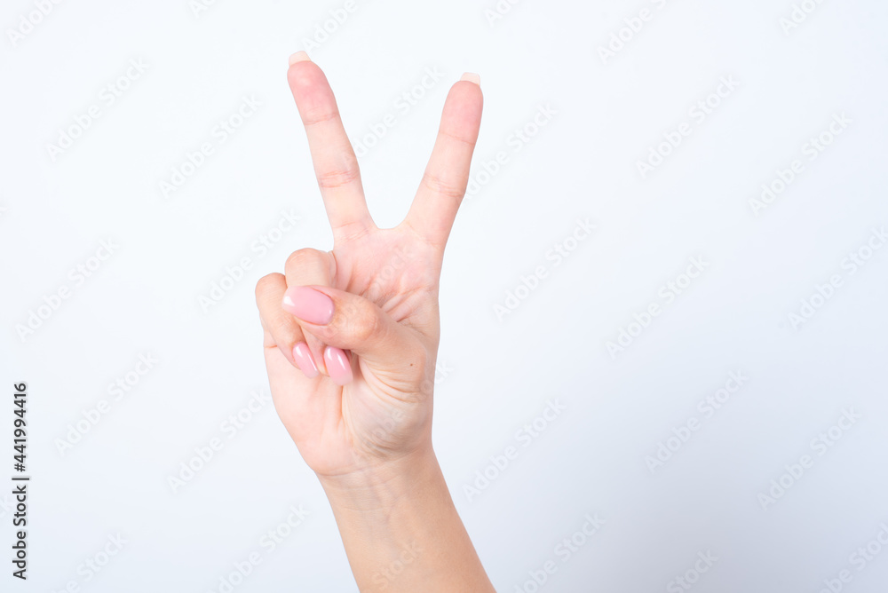 hands isolated on white background showing number 2, V sign. hands isolated on white background showing number 2, V sign.