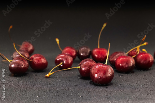 juicy ripe cherries on a dark background
