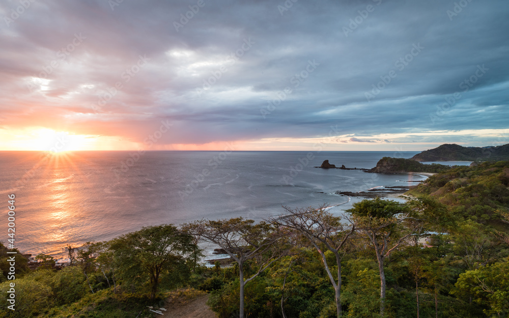 View of the pacific coastline of Nicaragua from above. Playa Maderas, one of the best surfing spots, at sunset.