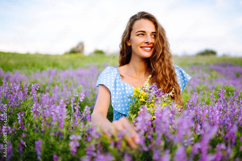 Portrait of beautiful woman in amazing in a blooming field. Nature, vacation, relax and lifestyle. Summer landscape. Portrait of beautiful woman in amazing in a blooming field. Nature, vacation, relax and lifestyle. Summer landscape.
