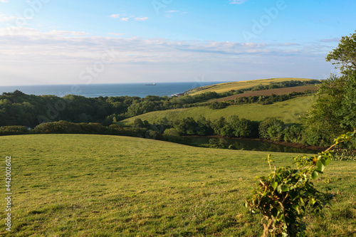 View over Porth Creek down towards Towan Beach and the English Channel beyond: Roseland Peninsula, Cornwall, UK photo