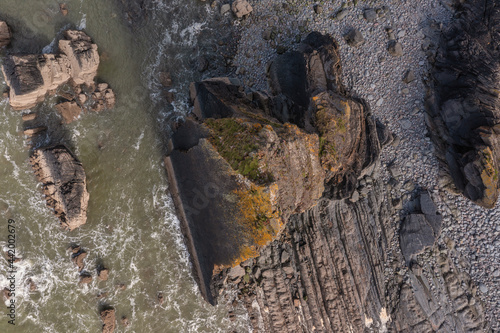 Stunning aerial drone flying landscape image of Blackchurch Rock on Devonian Geological formation