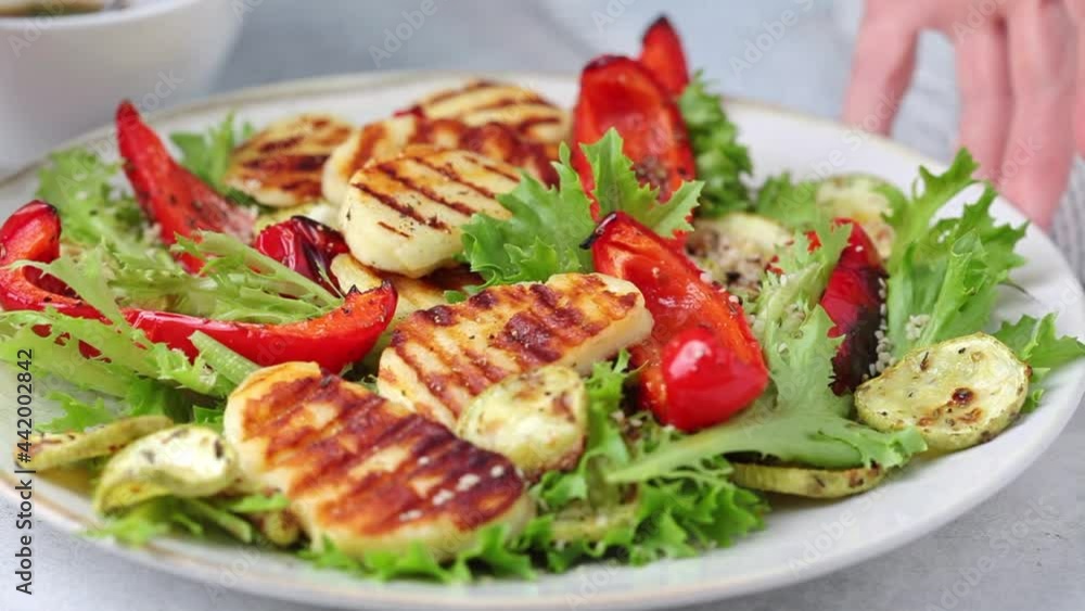 Grilled halloumi cheese salad with baked vegetables. Grilled halloumi cheese salad with baked vegetables.