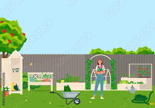 Gardener girl takes care of the garden