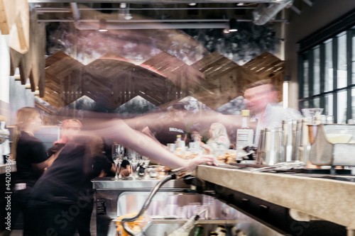 Long Exposure of a Bartender Making Drinks