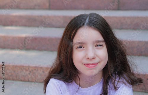 portrait of a beautiful girl in the park on summer vacation. photo