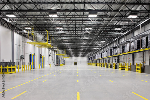 Interior of empty warehouse industrial storage building photo