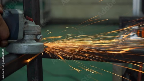 crop photo of worker cutting metal