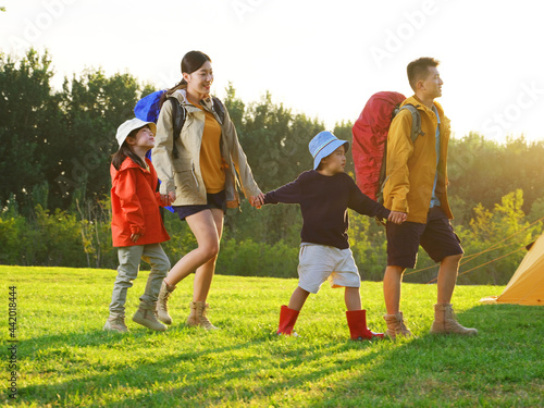 A Happy family of four outdoor hiking