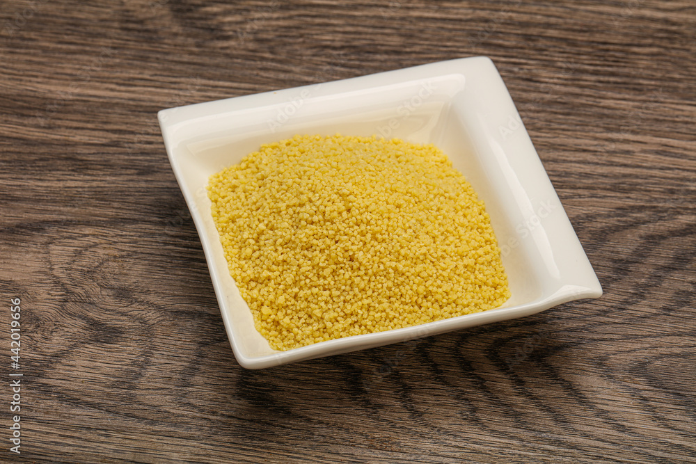 Raw cous cous heap in the bowl Raw cous cous heap in the bowl
