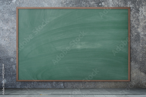 Blackboard texture. Empty blank green chalkboard with chalk traces.  Concrete background. Stock Photo
