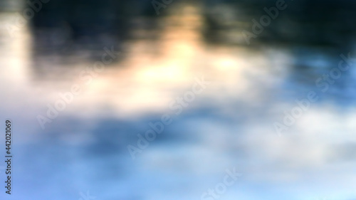 Sea water blurred background with bokeh lights reflections