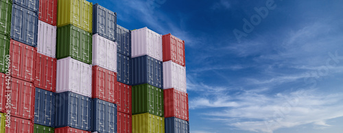 Harbor freight. Stack of containers in a harbor with blue sky on background. 3d render
