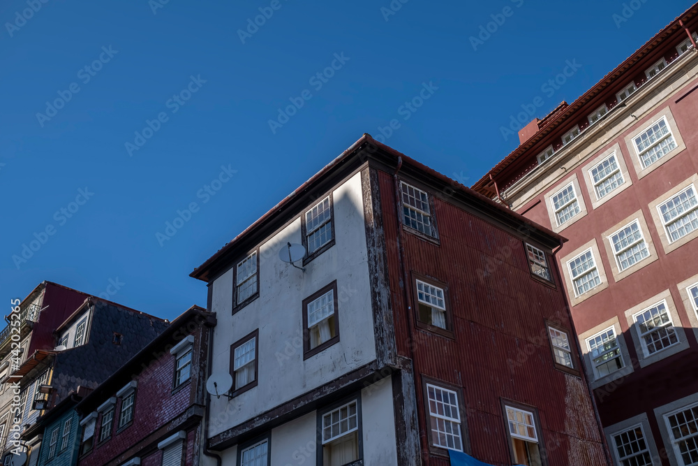 View of the residential buildings on one of the streets in the historical center of Porto, Portugal.