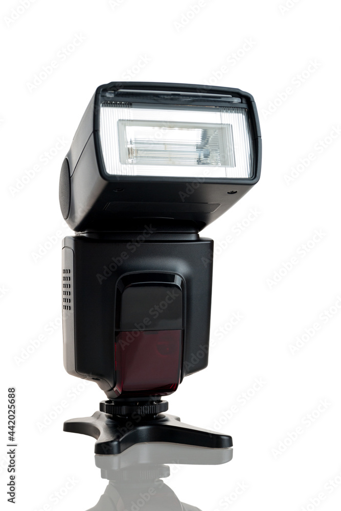 external on-camera flash for the camera, connected via a hot shoe or via a receiver, powerful flash, isolated on a white background external on-camera flash for the camera, connected via a hot shoe or via a receiver, powerful flash, isolated on a white background