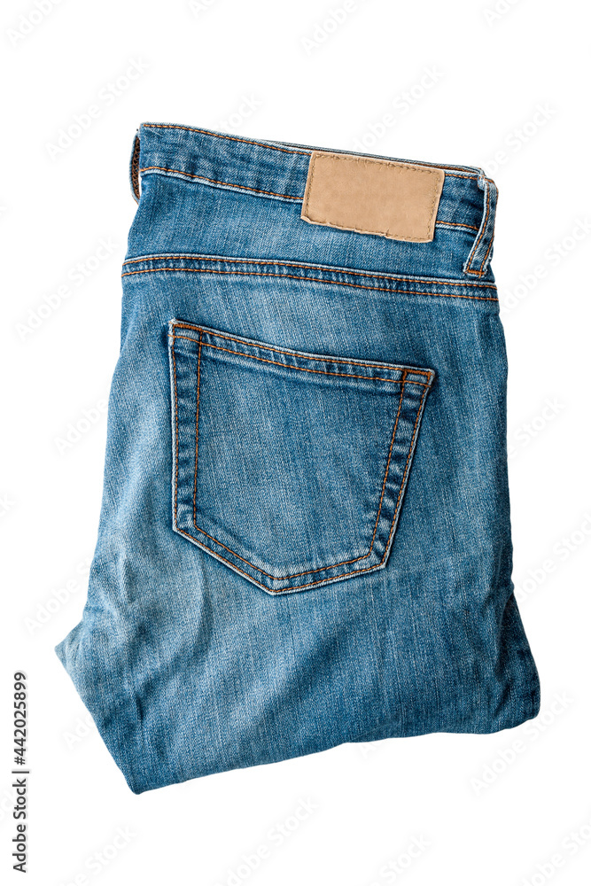 Denim jeans pants, folded, isolated on a white background, close-up Denim jeans pants, folded, isolated on a white background, close-up