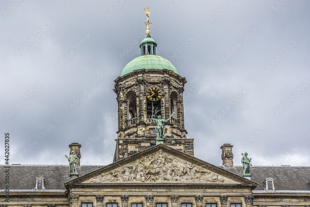 Architectural fragments of Amsterdam Royal Palace building (Koninklijk Paleis) at Dam Square. Classicism style Palace built as city hall during Dutch Golden Age (1648 - 1655). Amsterdam, Netherlands.